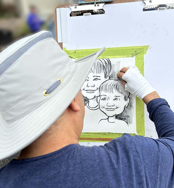Montreal caricature artist drawing at a live event Montreal caricature artist drawing